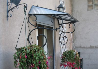 Marquise en fer forgé vosgienne pour porte à Martigues
